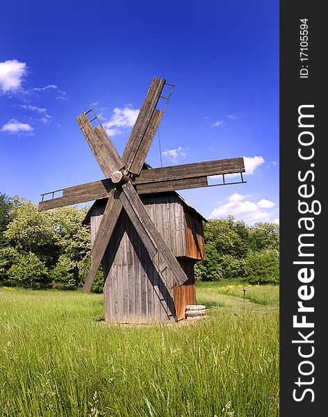 Windmill On Green Field