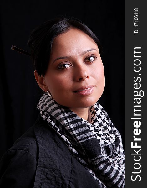 Portrait of hispanic girl looking at the camera on black background. Portrait of hispanic girl looking at the camera on black background