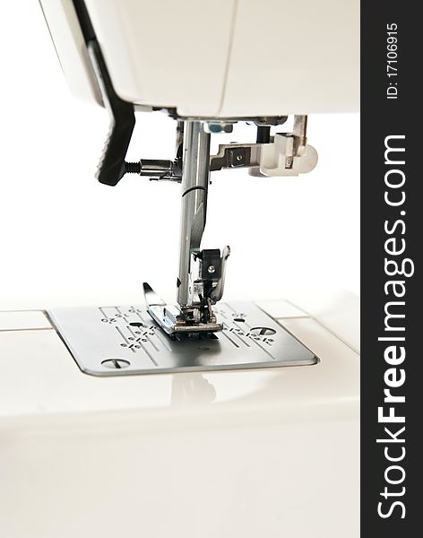 Sewing machine on white background. Details. Sewing machine on white background. Details