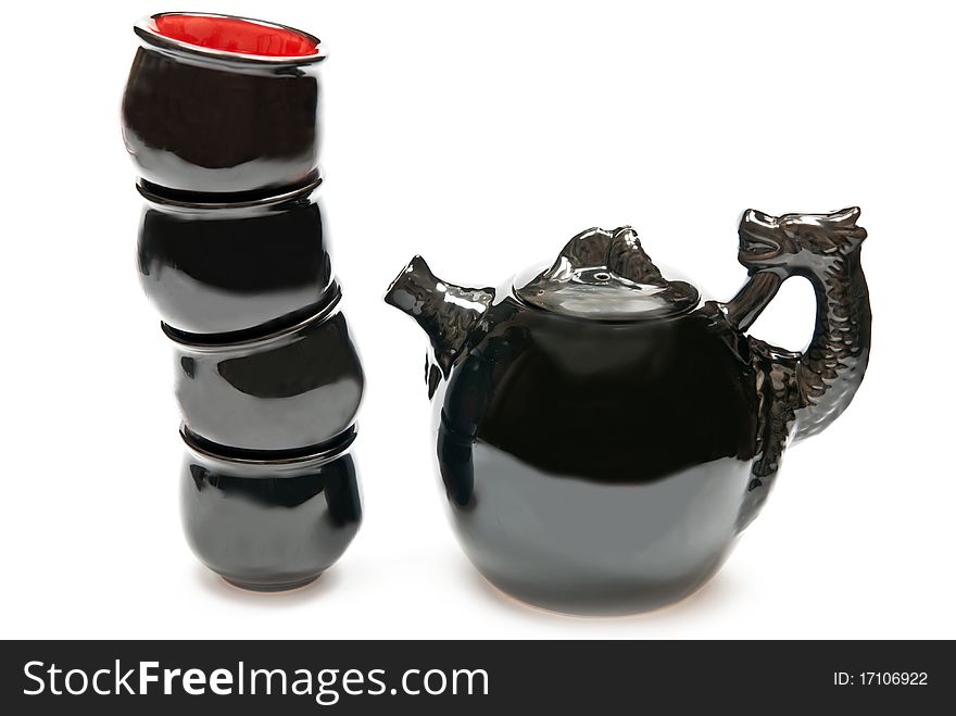 Black and red cups and teapot isolated on white background. Black and red cups and teapot isolated on white background