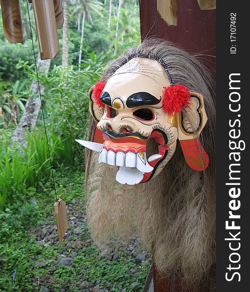 Balinese mask with jungle background