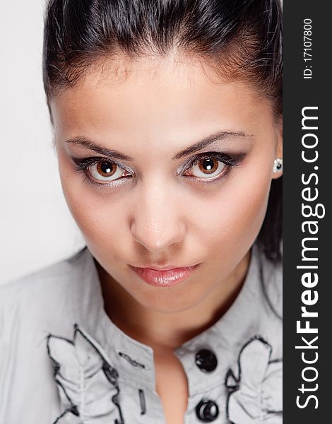 Close up studio portrait of young hispanic woman