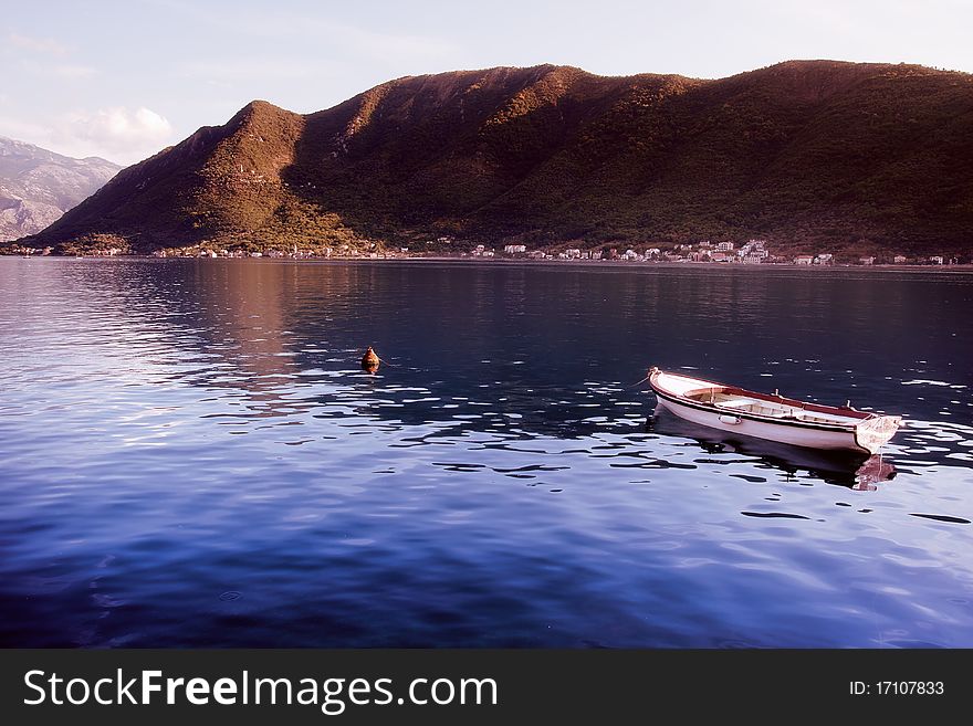 Peaceful view from Montenegro - boat, water and mountains. Peaceful view from Montenegro - boat, water and mountains