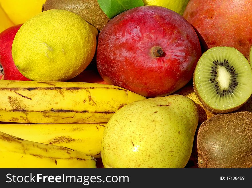 Colored and mature fruits in basket. Colored and mature fruits in basket.