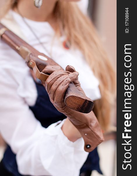 A women handing an old pistol