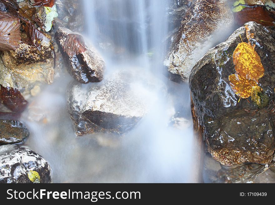 Landscape with mountain stream and cascades