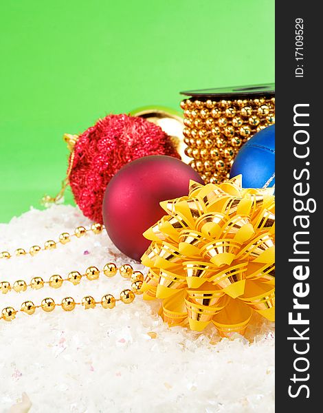 Christmas decoration with snow on green background