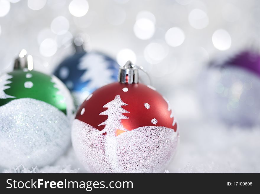Bright christmas balls on abstract light background.