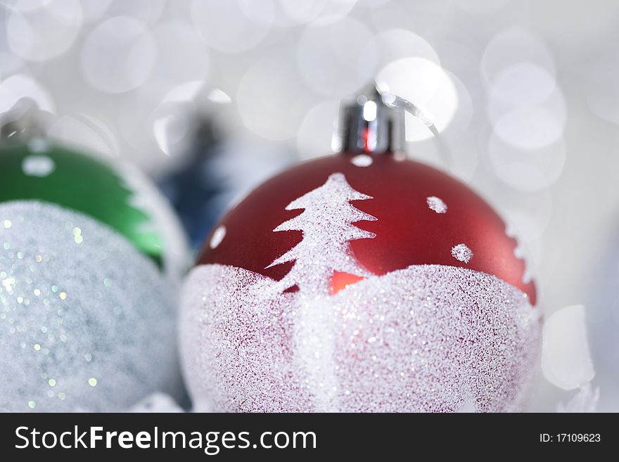 Bright christmas balls on abstract light background.