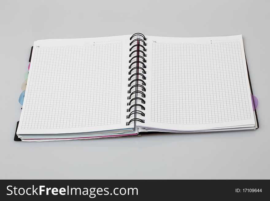 Spiral notebook a gray background