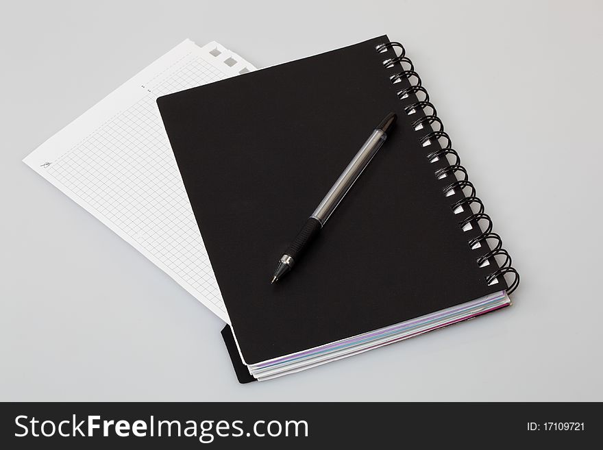 Spiral notebook on a gray background
