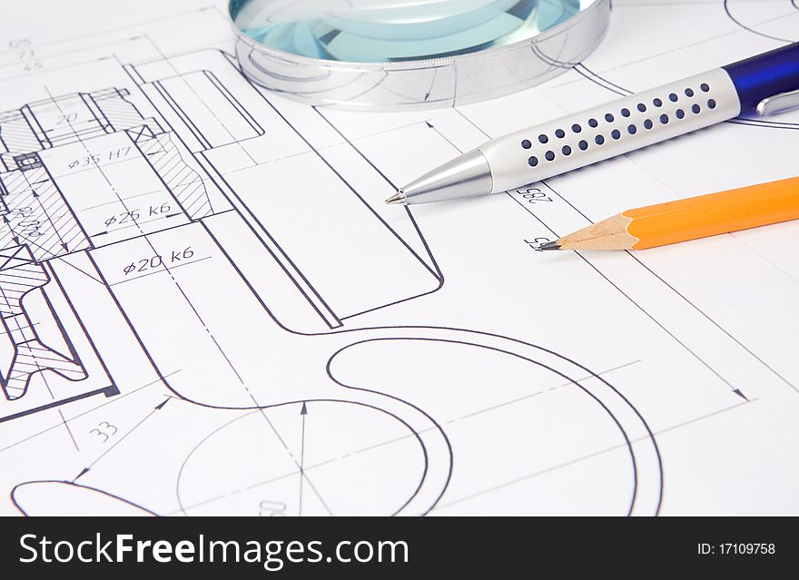 Drafting of crane hook with pencil, pen and magnifier. Drafting of crane hook with pencil, pen and magnifier