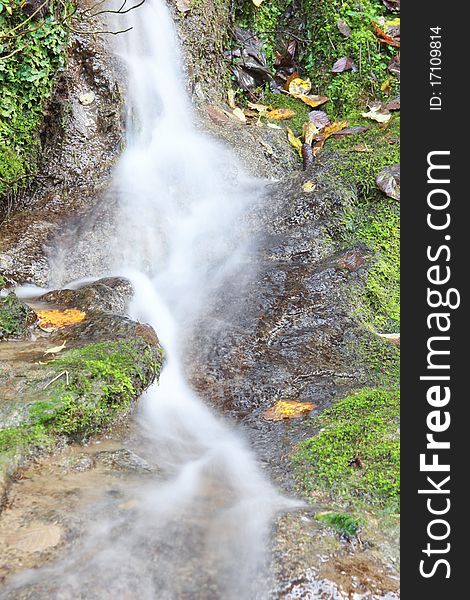 Landscape with mountain stream and cascades