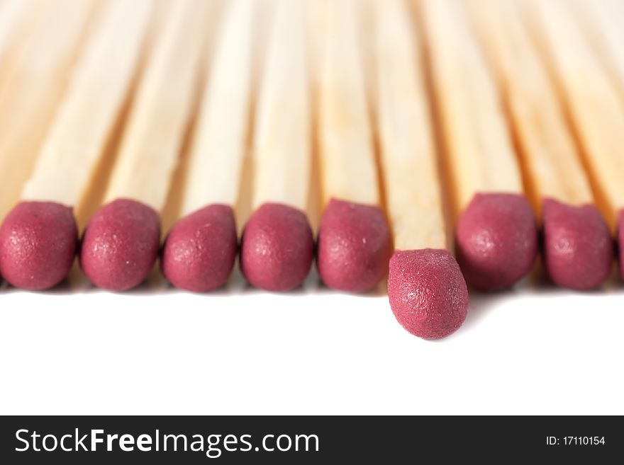 Macro view of row of matches isolated over white