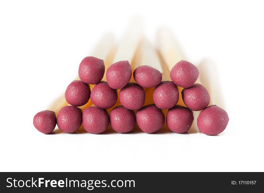 Macro view of stack of matches isolated over white. Macro view of stack of matches isolated over white