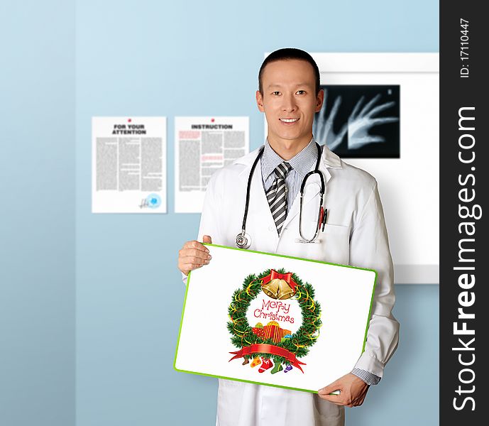 Doctor with empty board in his hands with Merry Christmas picture