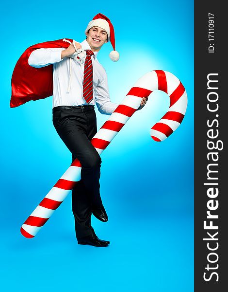 Portrait of a handsome business man in Santa Claus hat. Christmas. Portrait of a handsome business man in Santa Claus hat. Christmas.