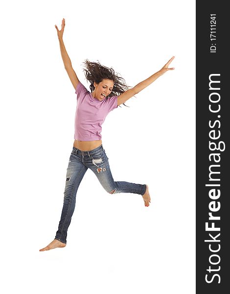 Cute young woman with jeans jumping energetically