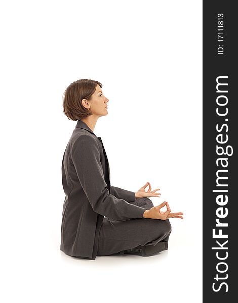 Young businesswoman in suit doing yoga. Young businesswoman in suit doing yoga