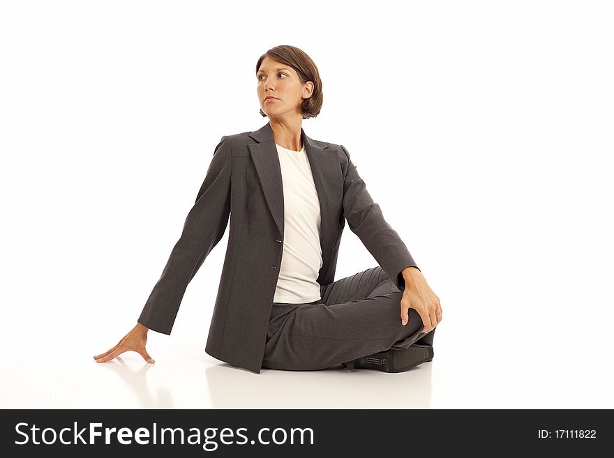 Young businesswoman in suit doing yoga. Young businesswoman in suit doing yoga