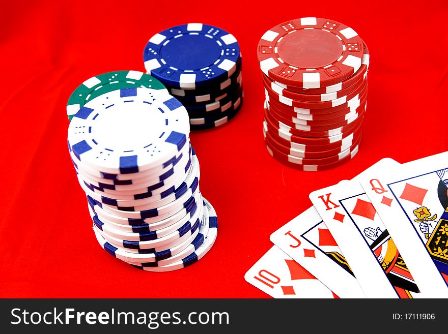 Poker chips isolated on red