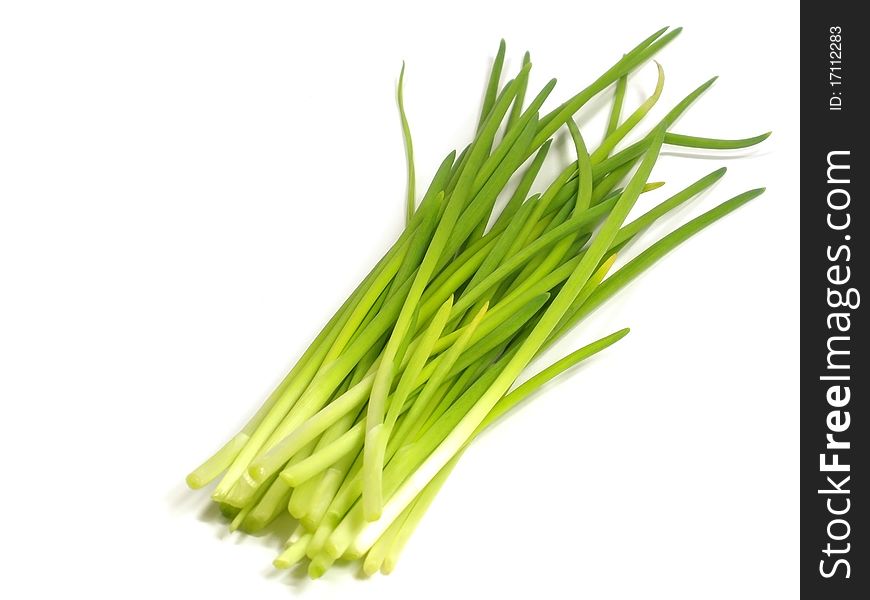Young green onions on the white isolate background