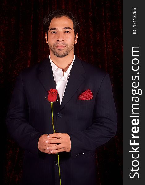 A gentleman suitor offers a rose. A gentleman suitor offers a rose