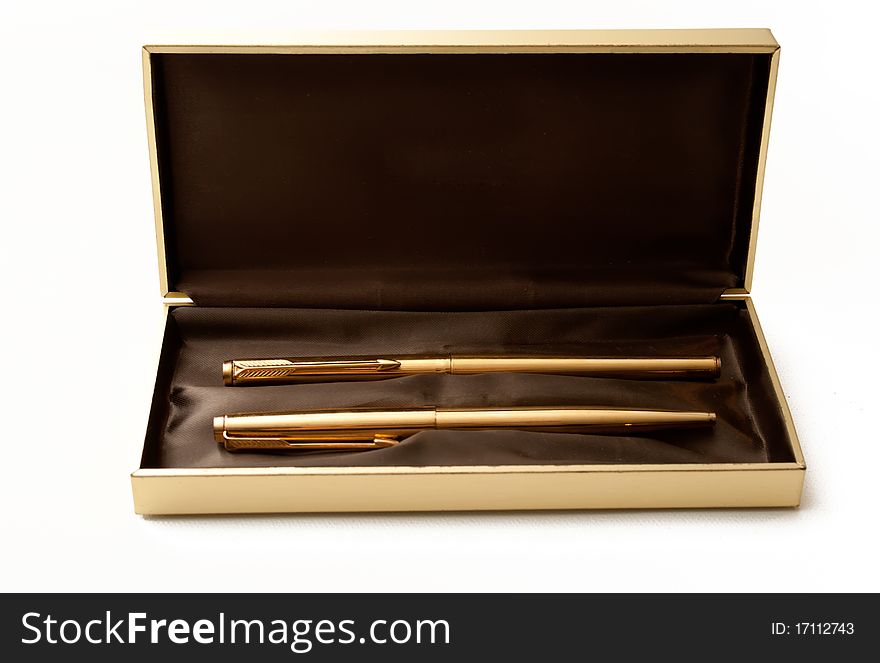 Golden ballpoint pen and fountain pen in luxury box. Golden ballpoint pen and fountain pen in luxury box