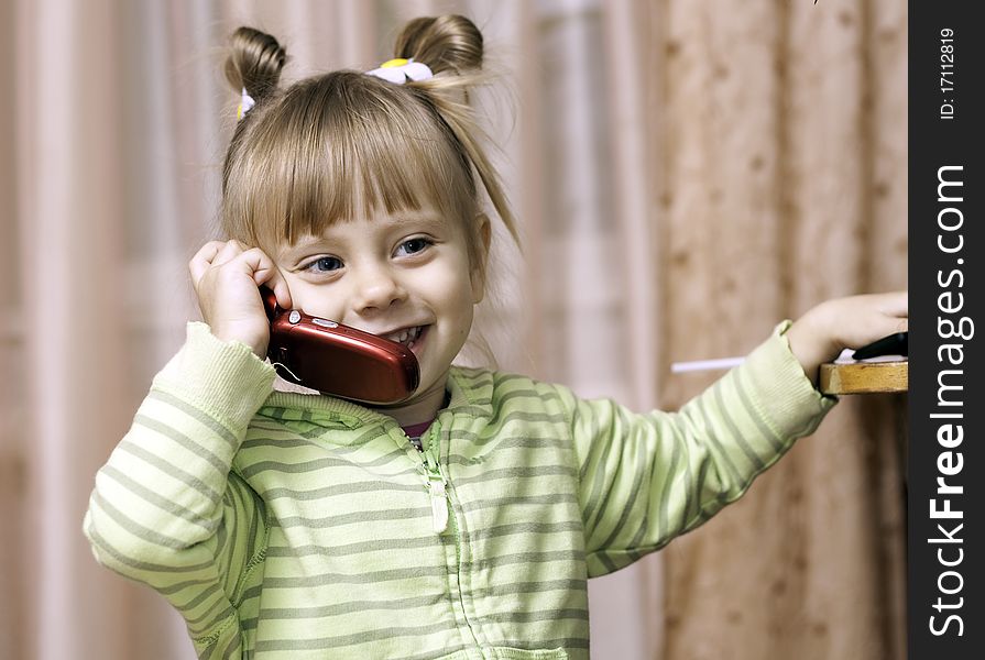 Charming Little Girl Talking On The Phone