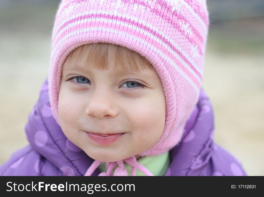 Adorable Little Girl Looking  At The Camera