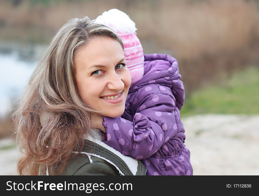 Mother holding a baby outdoor