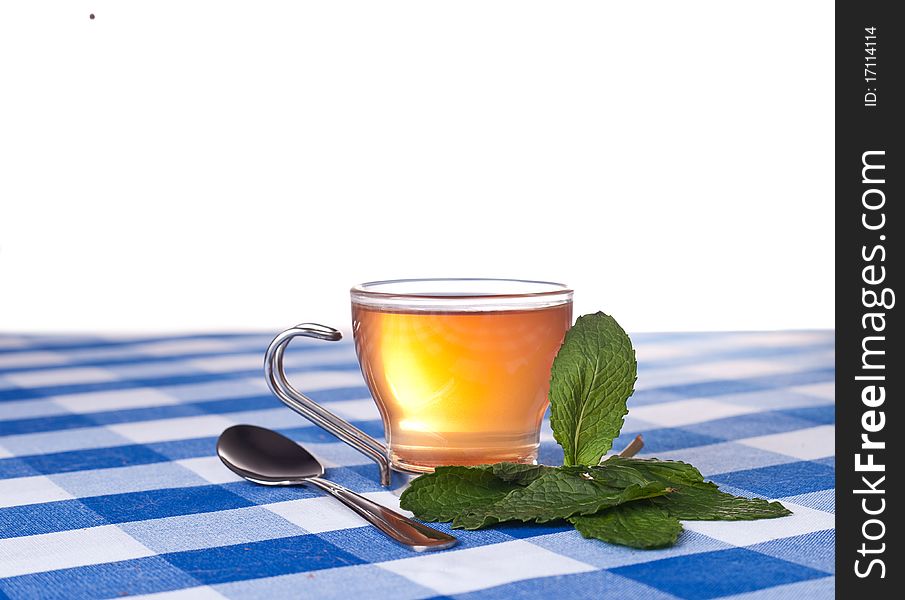 Herbal tea on blue tablecloth