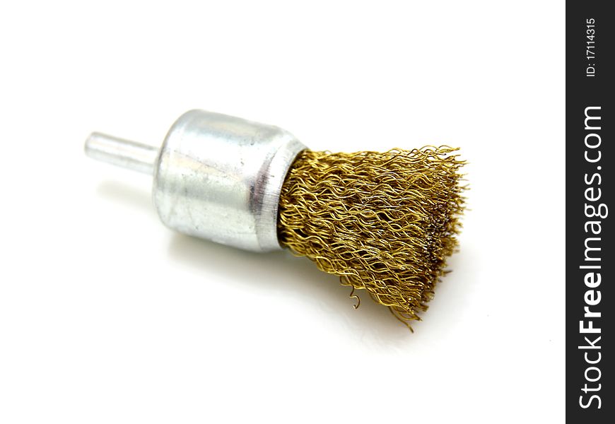 Yellow brush of rotation of a wire on a white background