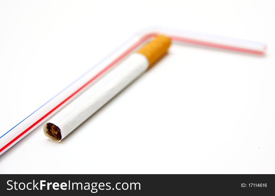 One cigaret and tubule for juice on a white background