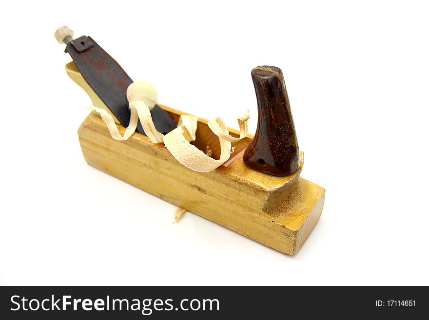 Wooden plane, boards and a shaving on a white background