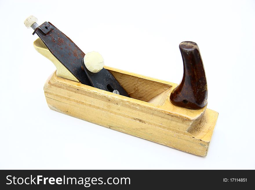 Wooden plane, boards and a shaving on a white background