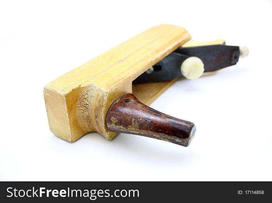 Wooden plane, boards and a shaving on a white background