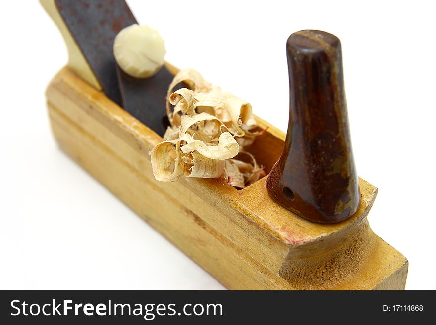 Wooden plane, boards and a shaving on a white background