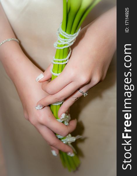 Bride was holding lily as her hand flower. Bride was holding lily as her hand flower