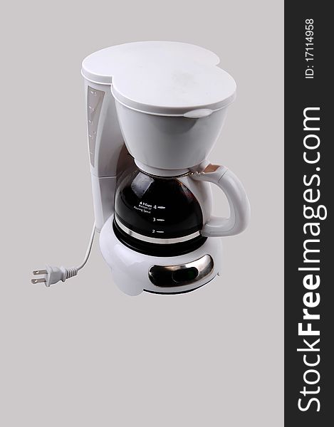A white small four cup coffeemaker, with coffee in, for light gray background. A white small four cup coffeemaker, with coffee in, for light gray background.