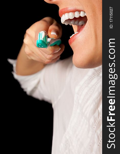 Woman healthy teeth closeup with toothbrush on black background. Woman healthy teeth closeup with toothbrush on black background