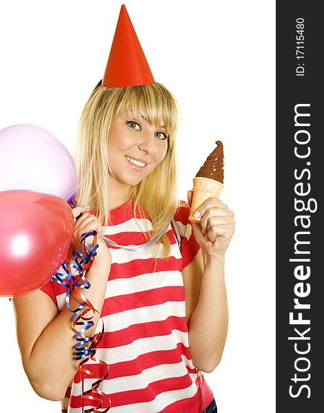 Portrait of a beautiful young woman who celebrates her birthday in one hand and balloons in the other chocolate ice cream on his head paper red cap. Portrait of a beautiful young woman who celebrates her birthday in one hand and balloons in the other chocolate ice cream on his head paper red cap