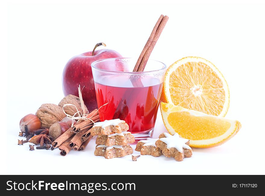 Mulled wine with spices and biscuits on white background. Mulled wine with spices and biscuits on white background