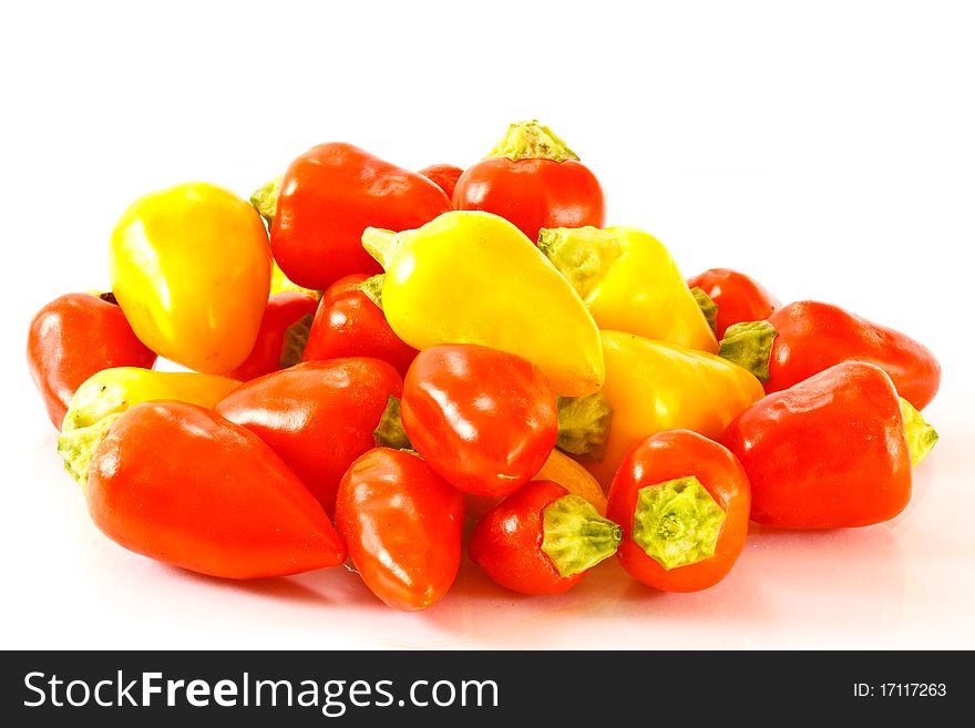 Acute multicolored peppers isolated on white background. Acute multicolored peppers isolated on white background