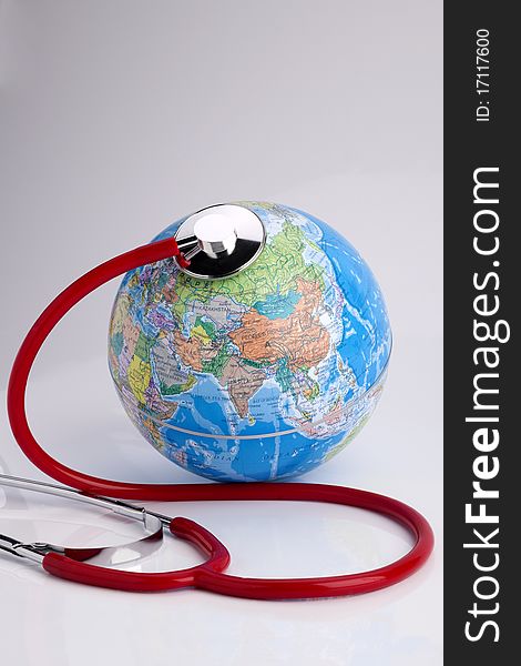 Red stethoscope on the Globe. Red stethoscope on the Globe