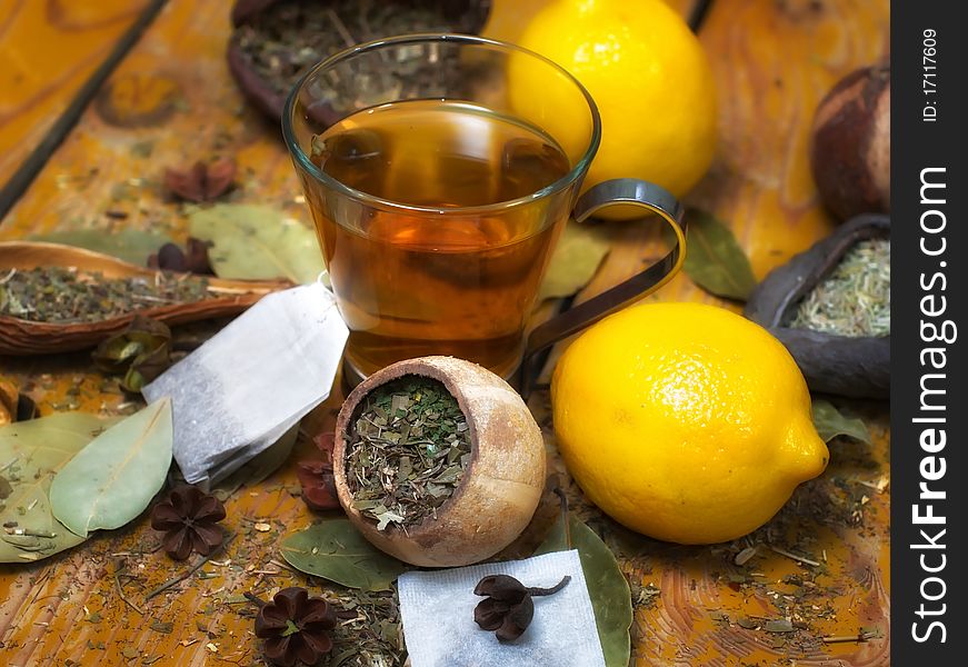 Cup of peppermint tea with diverse herbs and lemon