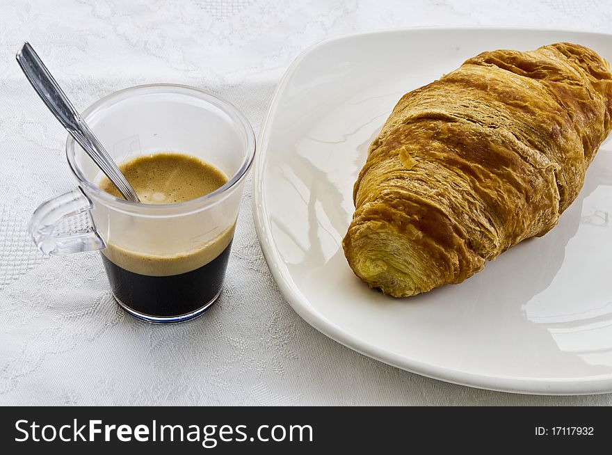 Coffee and croissant with great colors in white background