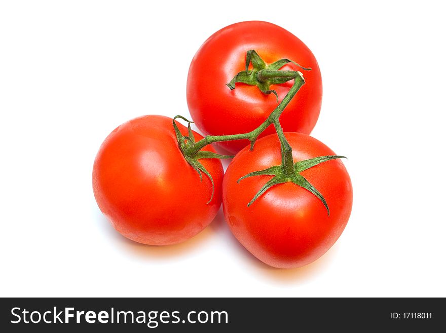 Three tomatoes isolated on a white background. Three tomatoes isolated on a white background.