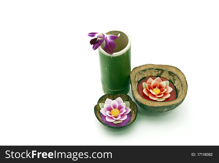 Floating candle in coconut shell with bamboo glass and fresh egg basket