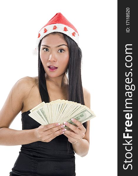 Woman with santa claus hat and a lot of money, isolated on white background. Woman with santa claus hat and a lot of money, isolated on white background